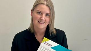 Claire Fisk signing of Insurance Times Destination Insurance